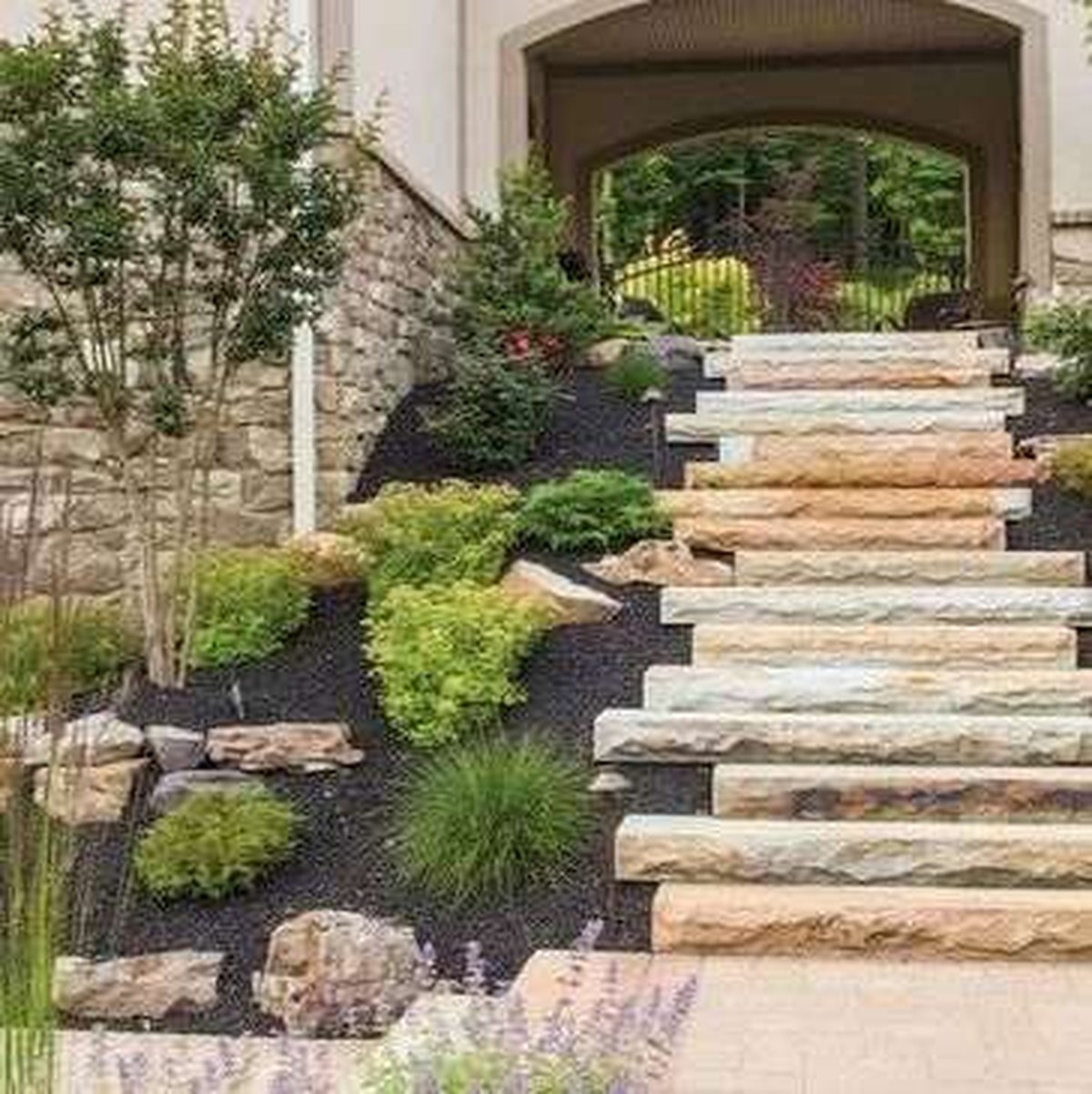 Stone stairway and landscaping by Four Seasons