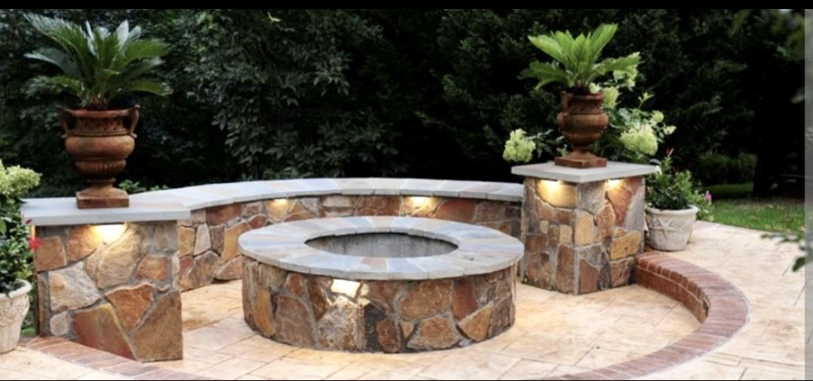 Custom fire pit with landscape lighting